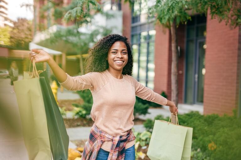 happy woman with lots of shopping bags